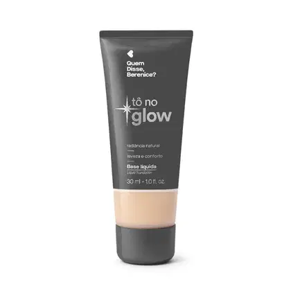 Bisnaga cinza de base líquida da marca Tô no Glow Quem disse, Berenice?, com detalhe na cor da base na parte inferior da embalagem e texto branco branco no rótulo.