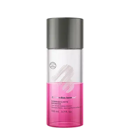 O frasco é cilíndrico, com uma tampa superior cinza e o corpo transparente, metade rosa. O rótulo exibe o nome da marca e do produto, bem como informações sobre o volume do produto, que é de 110 ml.