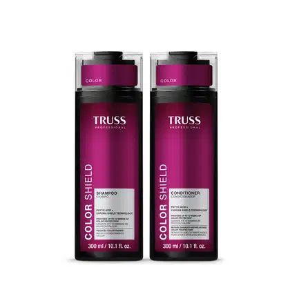 Dois frascos de shampoo e condicionador da marca TRUSS Professional, com embalagem em tom de roxo e preto, contendo informações sobre a tecnologia de proteção da cor.