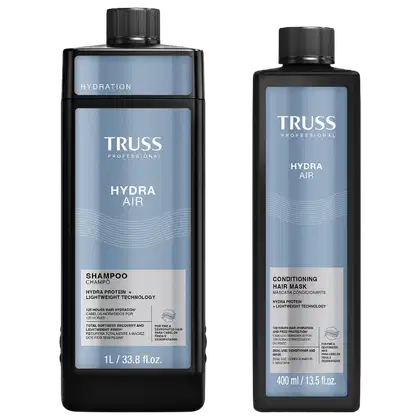 Dois produtos da linha Truss Professional: um frasco de shampoo Hydra Air e um frasco de máscara condicionadora Hydra Air, ambos em embalagens pretas e azuis com detalhes em texto branco.