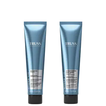 Dois tubos de produtos de cabelo da marca TRUSS Professional, um shampoo e uma máscara condicionadora, ambos em embalagens de plástico azul-claro com o logotipo da marca.