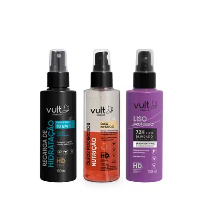 Três frascos de produtos Vult Cabelos: um leave-in spray, um óleo bifásico e um sérum antifrize, com embalagens pretas, brancas e roxas, respectivamente, e rótulos com informações sobre os produtos.