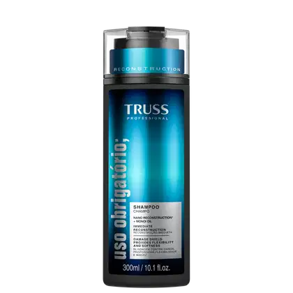 Frasco de shampoo da marca TRUSS Professional, com embalagem em tons de azul e preto, apresentando o nome da linha "Uso Obrigatório" e informações sobre a fórmula com "Nano Reconstruction" e "Monoi Oil".