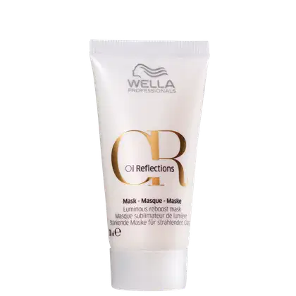 Tubo branco de máscara facial da marca Wella Professionals, com rótulo dourado e texto "Oil Reflections" destacado. Produto de cuidados capilares com promessa de luminosidade.