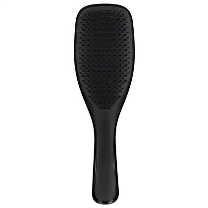 Escova de cabelo preta da marca Tangle Teezer, com design ergonômico e superfície ponteada para facilitar o desembaraço dos fios.