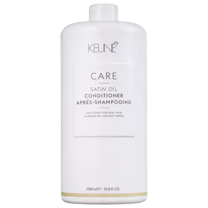 Frasco branco da linha Care da Keune, contendo condicionador de óleo de seda. Rótulo com nome do produto, "Satin Oil Conditioner", e informações sobre o uso em cabelos opacos.
