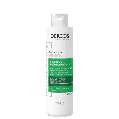 Frasco branco de shampoo dermatológico da marca Dercos Technique, com rótulo verde indicando "Anticaspa Sensível" e informações sobre o produto. Embalagem cilíndrica com tampa.