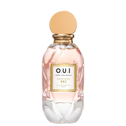 Frasco de perfume O.U.i. Madeleine 862, com embalagem de vidro rosa e detalhes dourados, rótulo com nome da fragrância e informações sobre a marca.