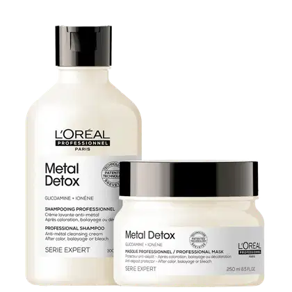 Produtos da linha Metal Detox da L'Oréal Professionnel, incluindo um frasco de shampoo e um pote de máscara, ambos com embalagem branca e preta com detalhes em prata.
