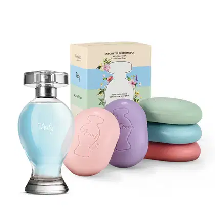 Dois itens Boticollection: caixa colorida com flores e logo da marca O Boticário, contendo cinco sabonetes em barra em cores variadas e um frasco curvilíneo com líquido azul, borrifador prateado e tampa cristal de desodorante colônia Thaty.