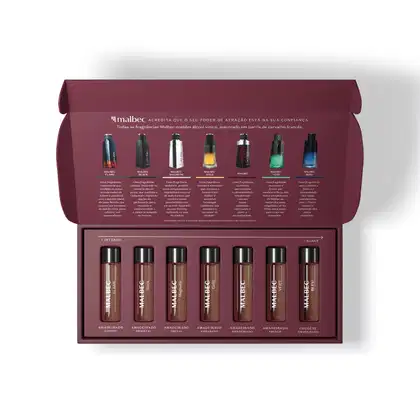 Caixa roxa contendo sete vidros transparente com tampa preta e letras brancas que trazem uma amostra das diversas linhas da marca Malbec para experimentação, sendo as linhas Flame, Black, Magnetic, Gold, Vert, Bleu e a Original.