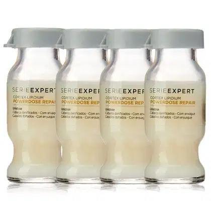 Quatro frascos de tratamento capilar da linha Serie Expert da L'Oréal Professionnel, com rótulos indicando "Cortex Lipidium Powerdose Repair" e informações sobre o produto.