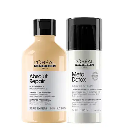 O conjunto de produtos L'Oréal Professionnel inclui um shampoo Absolut Repair com fórmula de proteína e ômega-9, e um creme de proteção Metal Detox com glicosaminoglicanos e ioneno, ambos em embalagens pretas e brancas.