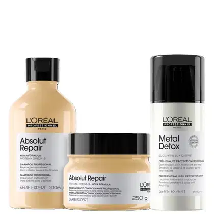 Três produtos da linha L'Oréal Professionnel: shampoo Absolut Repair em frasco de 300ml, tratamento condicionante Absolut Repair em pote de 250g e creme Metal Detox em embalagem de 100ml, todos com design preto e dourado.