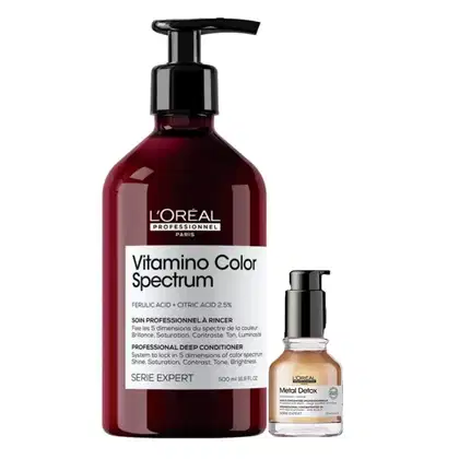 O produto é um condicionador profissional da linha Vitamino Color Spectrum da L'Oréal Professionnel, em embalagem de 500 ml com bomba dosadora preta. Ao lado, há um frasco de 30 ml do tratamento Metal Detox da mesma marca.
