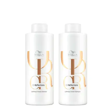 Dois frascos brancos da linha Oil Reflections da Wella Professionals, com rótulos em tons de amarelo e marrom, contendo um shampoo luminoso revelador.