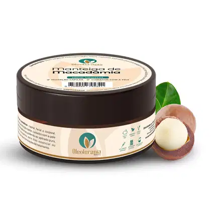 O produto apresentado é uma manteiga de macadâmia da marca Oleoterapia Brasil. Ao lado do pote, há alguns frutos de macadâmia, mostrando a matéria-prima utilizada na fabricação do produto.