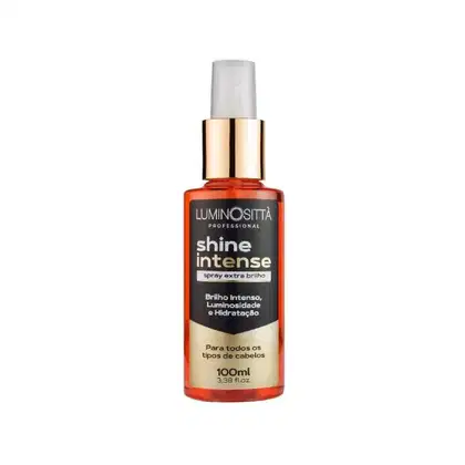 Spray de brilho espelhado. O frasco é de cor laranja com detalhes pretos e dourados, contendo 100ml do produto. No rótulo, é possível ver as informações escritas em português brasileiro sobre as propriedades e benefícios do spray para os fios.