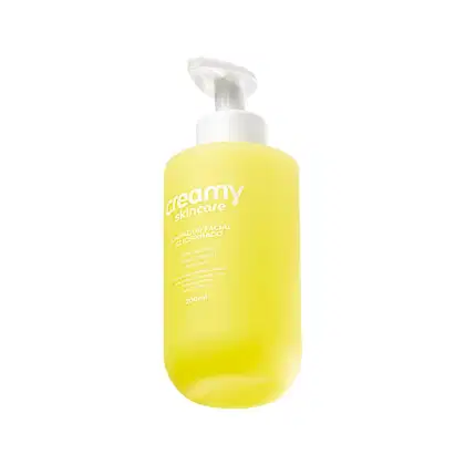 Frasco de 200ml de limpador facial glicerinado da marca Creamy Skincare, com embalagem de plástico branca e amarela, contendo informações sobre o produto.