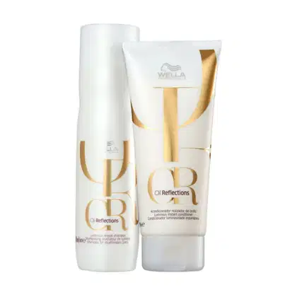 Dois produtos da linha Oil Reflections da Wella Professionals: um frasco de shampoo e um tubo de condicionador, ambos com embalagens brancas e detalhes dourados, exibindo o nome da linha.