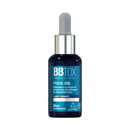 Frasco de vidro azul escuro com conta-gotas, contendo o produto "BB Tox Prime Oil" da marca Grandha, com rótulo destacando "Absolute Repair" e "Hair Therapy" com alta dosagem de ácido hialurônico.