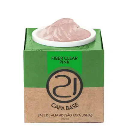 A imagem mostra uma base de alta adesão para unhas. O produto vem em uma embalagem retangular de papelão verde e marrom. No centro, há um recipiente branco contendo o produto, que parece ser um gel em tom rosado.