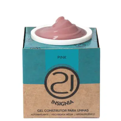 A imagem mostra o gel construtor para unhas em uma embalagem retangular de papelão na cor turquesa e bege, com o logotipo da marca em preto. Contém um pote branco com o produto gel em tom rosa aparecendo no topo.