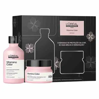 O conjunto de produtos L'Oréal Professionnel Vitamino Color inclui um frasco de shampoo, um pote de máscara e uma caixa preta com detalhes em rosa, apresentando informações sobre os benefícios para proteção da cor, brilho e hidratação