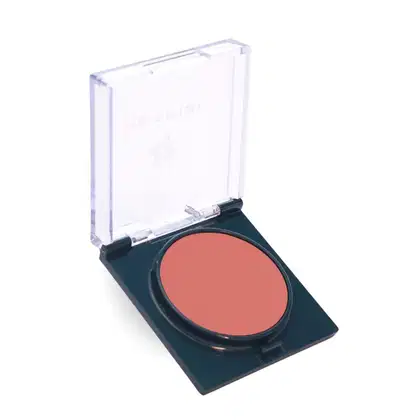 Blush cremoso da marca Petrizi Makeup, com embalagem preta e tampa transparente, contendo um blush de tom coral Soft Peach