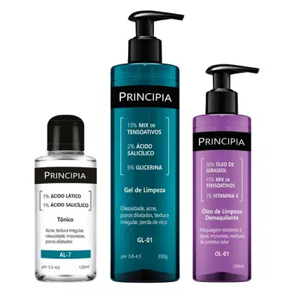 Três produtos da marca Principia: um tônico em frasco de 120ml, um gel de limpeza em embalagem de 350g com bomba e um óleo de limpeza desmaquiante em frasco de 200ml, todos com rótulos pretos e detalhes em azul e roxo.