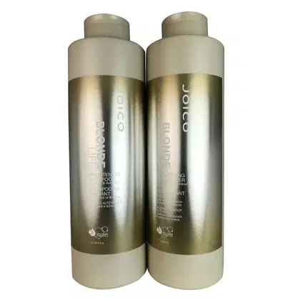 Dois frascos de shampoo Joico Blonde Life Brightening, com embalagem em tons de bege e dourado, contendo 1 litro cada. Os rótulos exibem o nome da marca e a descrição do produto.