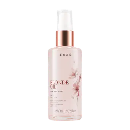 Frasco de óleo capilar Braé Blonde Oil, com embalagem branca e detalhes em rosa dourado, contendo 60ml do produto regenerador e nutritivo para cabelos loiros.
