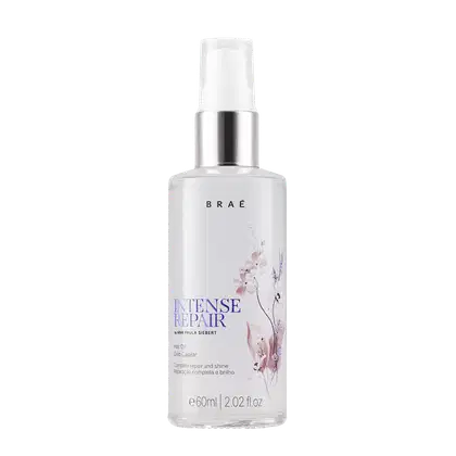 Frasco branco de 60ml com bomba de spray, contendo óleo capilar da marca Braé, com rótulo destacando "Intense Repair" e a assinatura da especialista Ivana Paula Siebert.