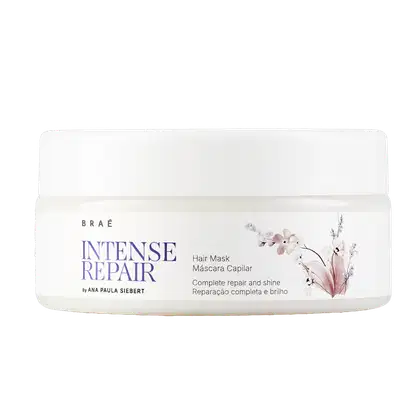 Embalagem branca com rótulo roxo e floral da linha Intense Repair da marca Braé, contendo máscara capilar para reparação e brilho completos dos cabelos.