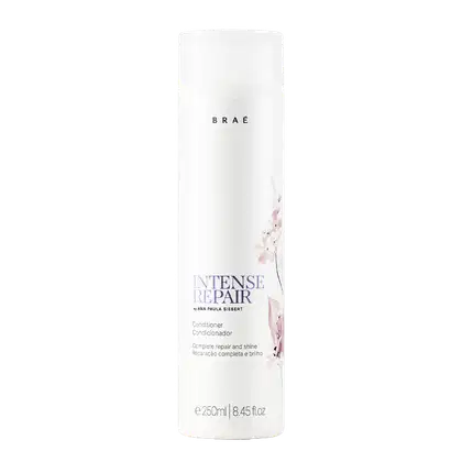 Frasco branco de condicionador da marca Braé, com rótulo em preto e rosa, apresentando o nome "Intense Repair" e a descrição "Complete repair and shine".