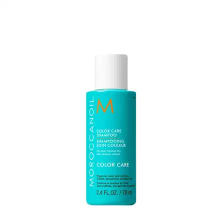 A imagem mostra o Shampoo Color Care 70ml da marca Moroccanoil. Embalagem plástica na cor azul turquesa, com letras brancas e pretas e logotipo da marca em laranja. O frasco tem uma bomba dosadora branca na parte superior.