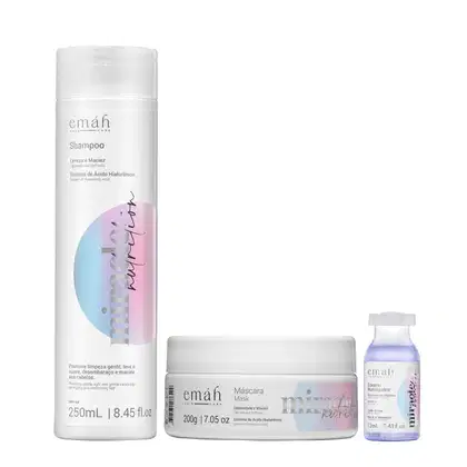 Shampoo, máscara e booster da linha Emáh Hair Care, com embalagens brancas e detalhes em cores pastel. O shampoo possui 250 mL, a máscara 200 g e o booster 13 mL, todos com sistema de ácido hialurônico.