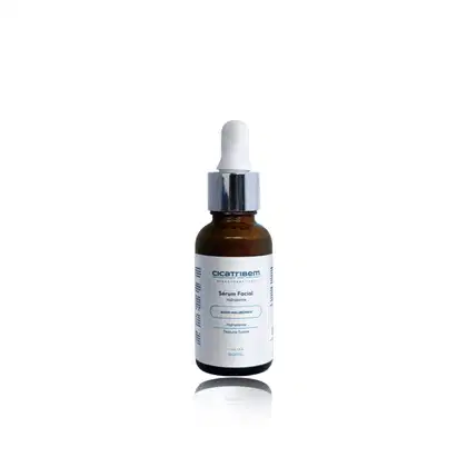 Frasco de vidro âmbar com conta-gotas contendo sérum facial hidratante da marca Cicatribem, com rótulo branco e azul destacando os ingredientes ácido hialurônico e textura suave.