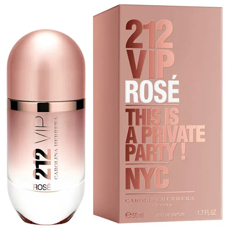 Frasco de perfume Carolina Herrera 212 VIP Rose, com embalagem de caixa rosa clara exibindo o nome do produto. O frasco possui formato cilíndrico com tampa dourada, em tons claros e neutros.