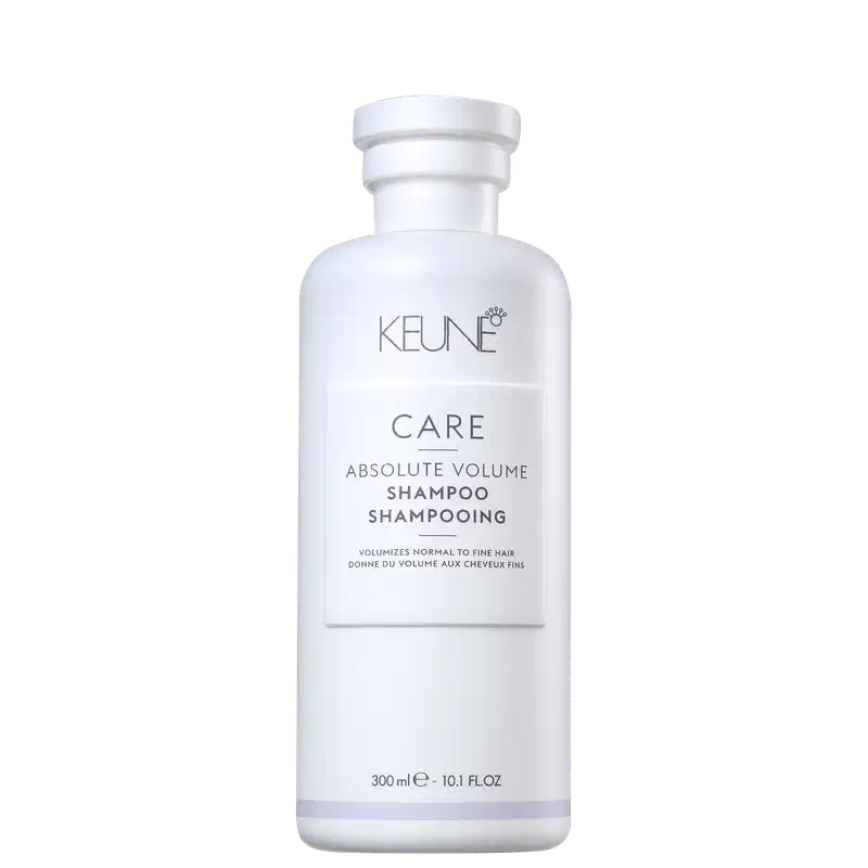 Frasco branco da linha Care da Keune, contendo Shampoo Absolute Volume. O produto é destinado a volumizar cabelos normais a finos, conforme indicado no rótulo.