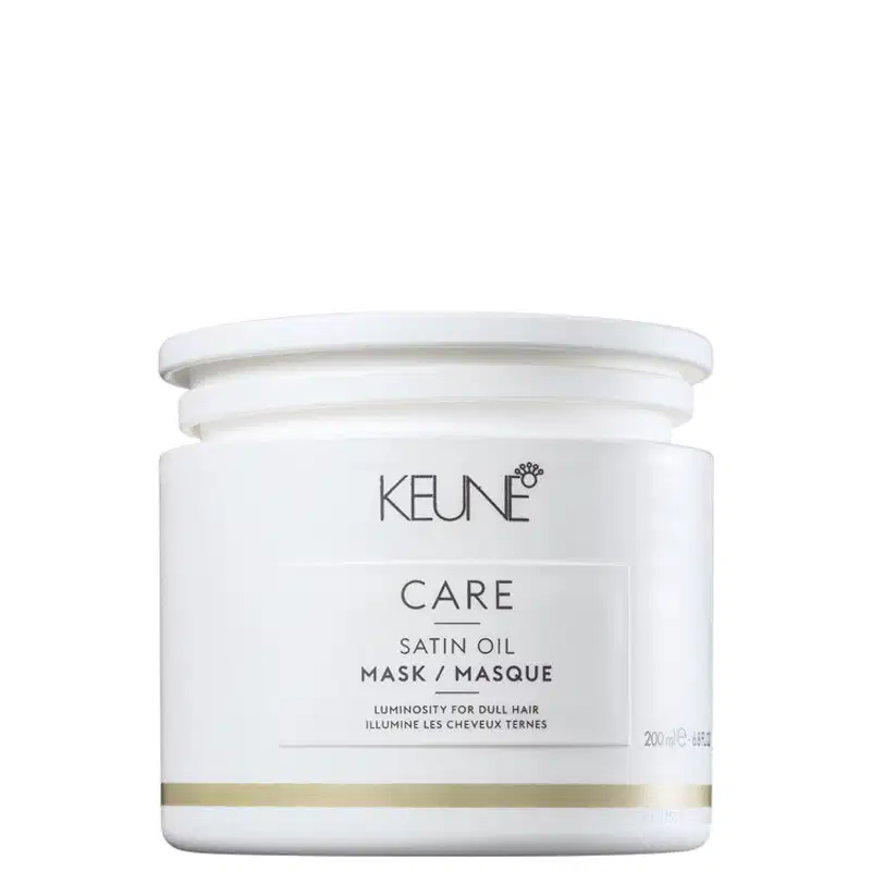 Frasco branco com rótulo da marca Keune, contendo máscara de óleo de seda para cabelos opacos, com informações sobre luminosidade e tratamento para cabelos.