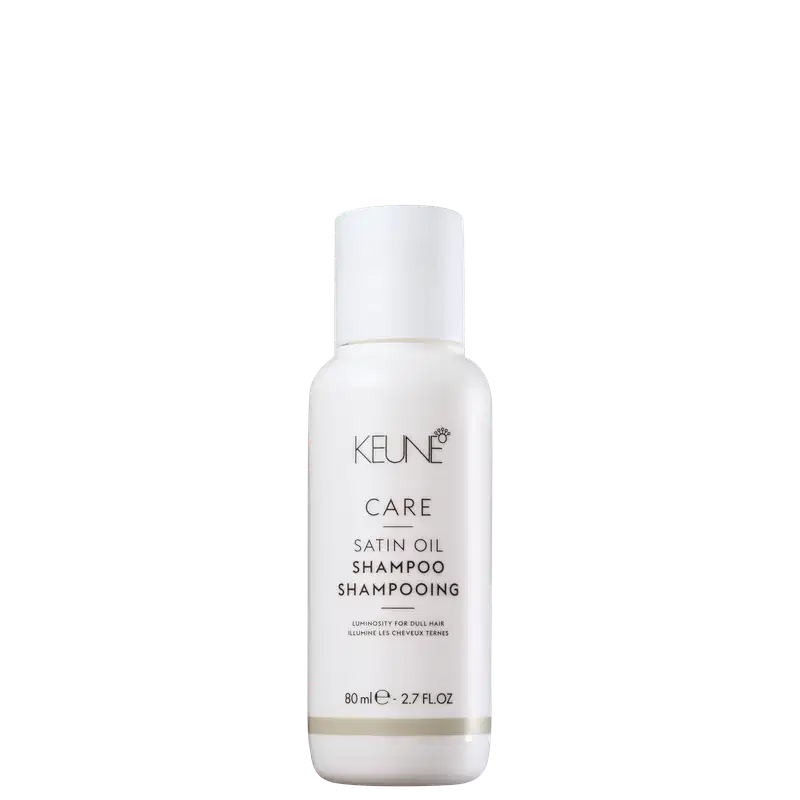 Frasco branco de 80 ml da linha Care da Keune, contendo o Shampoo de Óleo Satinado, com rótulo destacando a luminosidade para cabelos opacos.