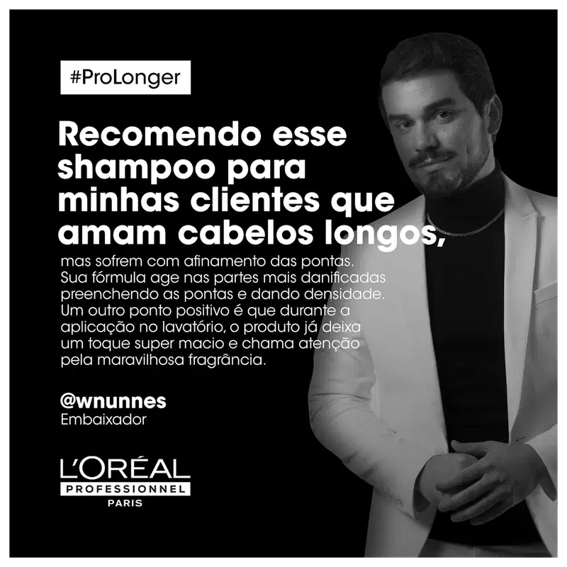 Imagem em preto e branco de um homem com barba e cabelos escuros, vestido formalmente, com texto sobre um produto de cuidados capilares L'Oréal Professionnel. O texto destaca os benefícios para cabelos longos, como maciez, densidade e fragrância agradável