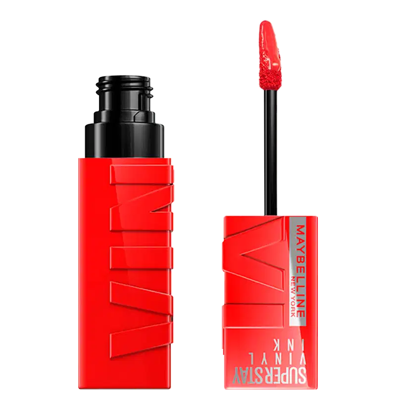 Produto de maquiagem da marca Maybelline, com embalagem vermelha e preta, contendo um aplicador de rímel vermelho. O produto é identificado como "Superstay Vinyl Ink" e possui um design moderno e chamativo.