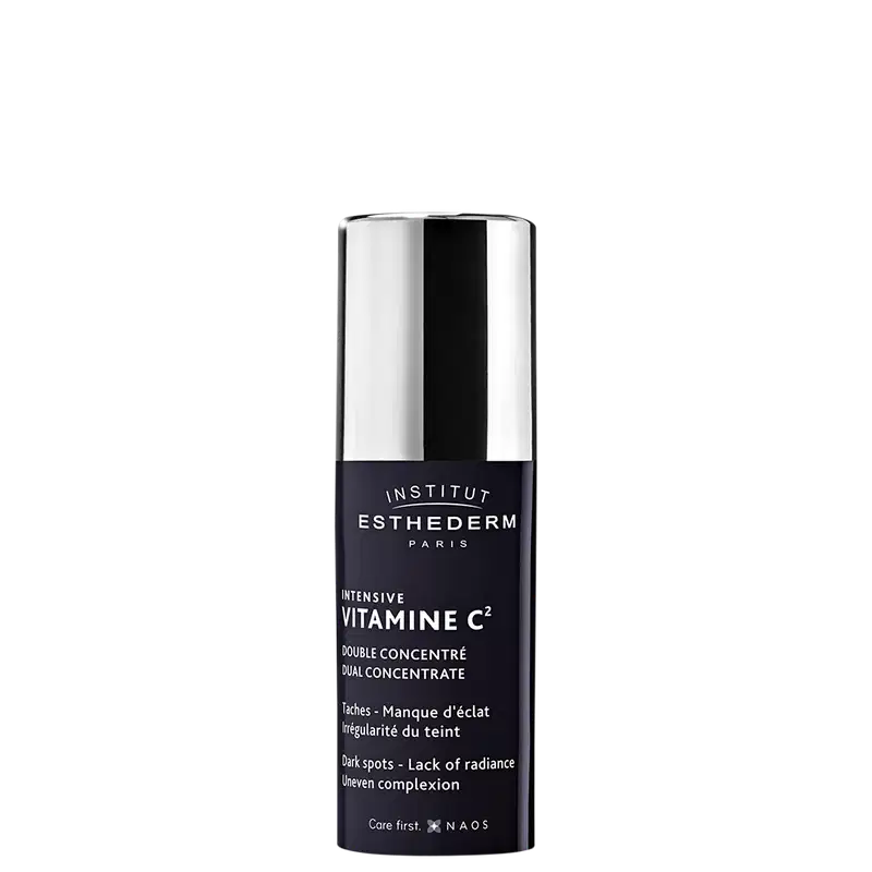 Frasco de tratamento intensivo de vitamina C2 da marca Esthederm. Embalagem preta e branca com texto destacando os benefícios do produto para manchas e falta de luminosidade da pele.