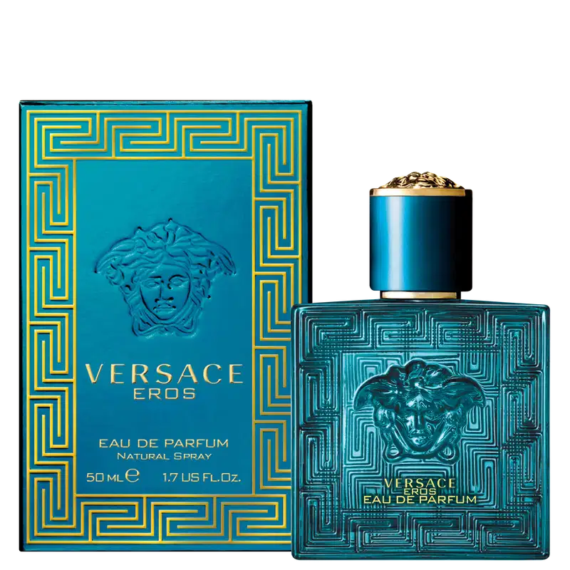 A imagem mostra a embalagem quadrada com detalhes em dourado com fundo azul turquesa. Nela, o nome da marca, do perfume, tipo de concentração e volumetria. Ao lado, o vidro do perfume.