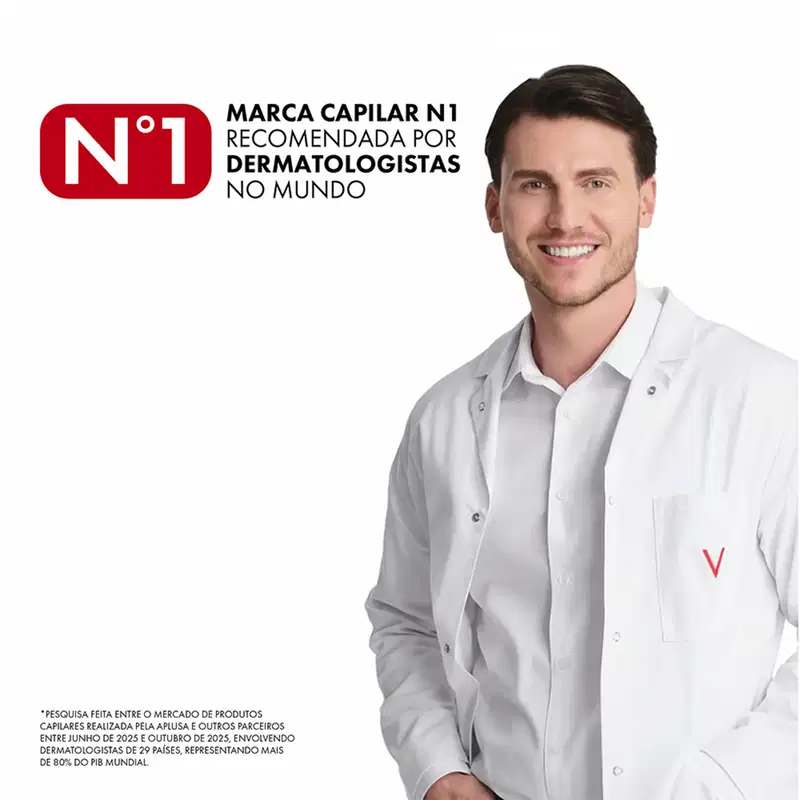 Imagem de um homem sorridente vestindo jaleco branco, com texto "MARCA CAPILAR N1 RECOMENDADA POR DERMATOLOGISTAS NO MUNDO" e logotipo da marca Vichy.