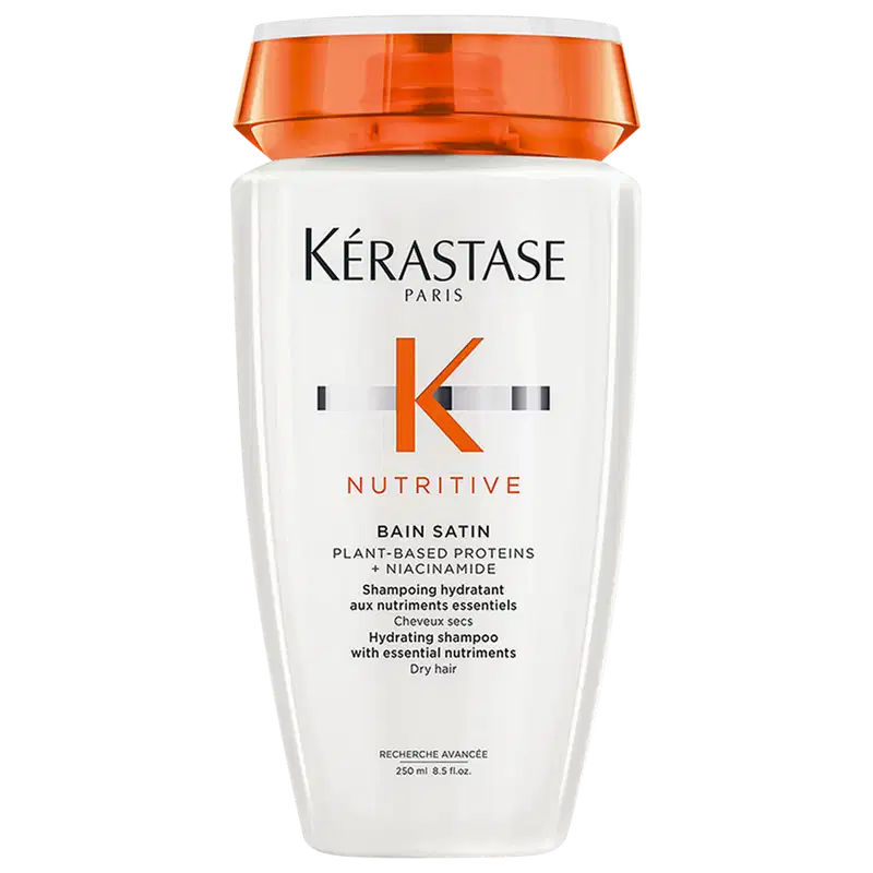 Frasco branco com tampa laranja da marca Kérastase do shampoo Nutritive Bain Satin 250ml com proteínas vegetais e niacinamida, indicado para cabelos secos.