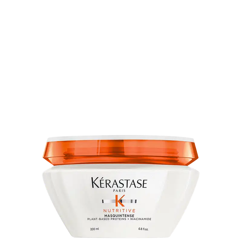 Frasco branco com tampa laranja da linha Nutritive da Kérastase, contendo 200 ml de máscara capilar à base de proteínas vegetais e niacinamida.