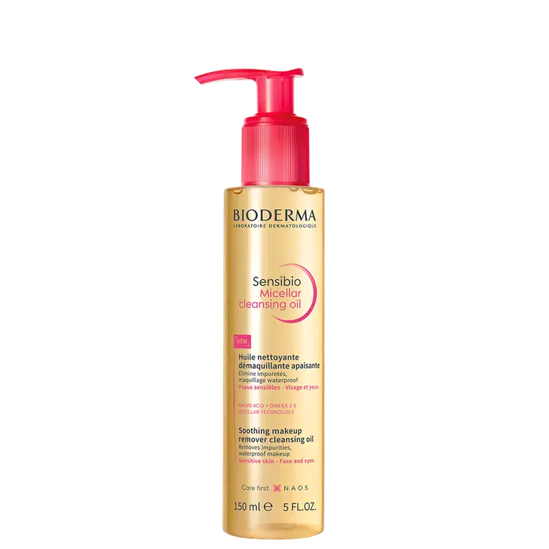 Frasco de óleo de limpeza micelar da marca Bioderma, com bomba doseadora vermelha, rótulo dourado e texto "Sensibio Micellar Cleansing Oil" em destaque.